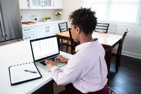 Women accessing ServiceLink's default solutions on her laptop