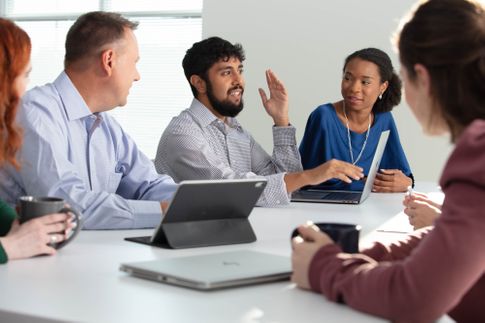 ServiceLink signing agent helping a husband and wife complete their loan transactions